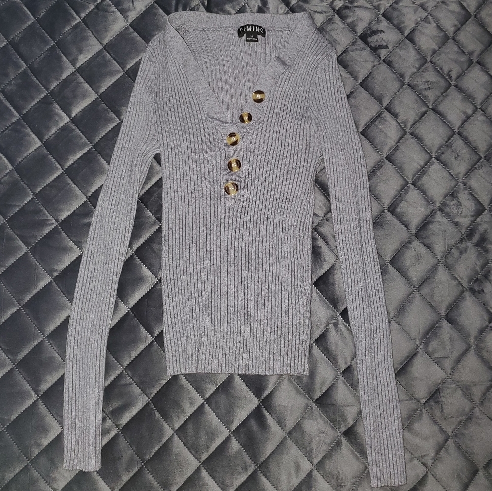 Long sleeve with buttons down the middle